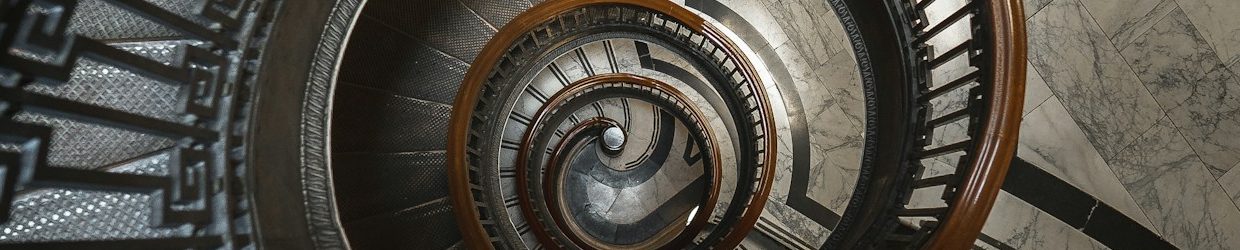 Eine spiralförmige Treppe, symbolisch für Schwindel verschiedenster Ursache